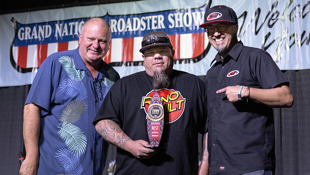 Winners holding trophy for the Ryno Built 1955 Chevy Bel Air