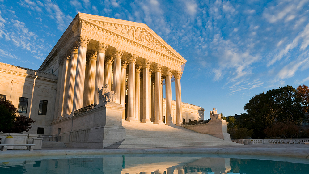 The front of the US Supreme Court in Washington, DC, at dusk.