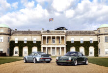 Two Porsches parked in front of Goodwood Estate