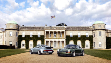Two Porsches parked in front of Goodwood Estate