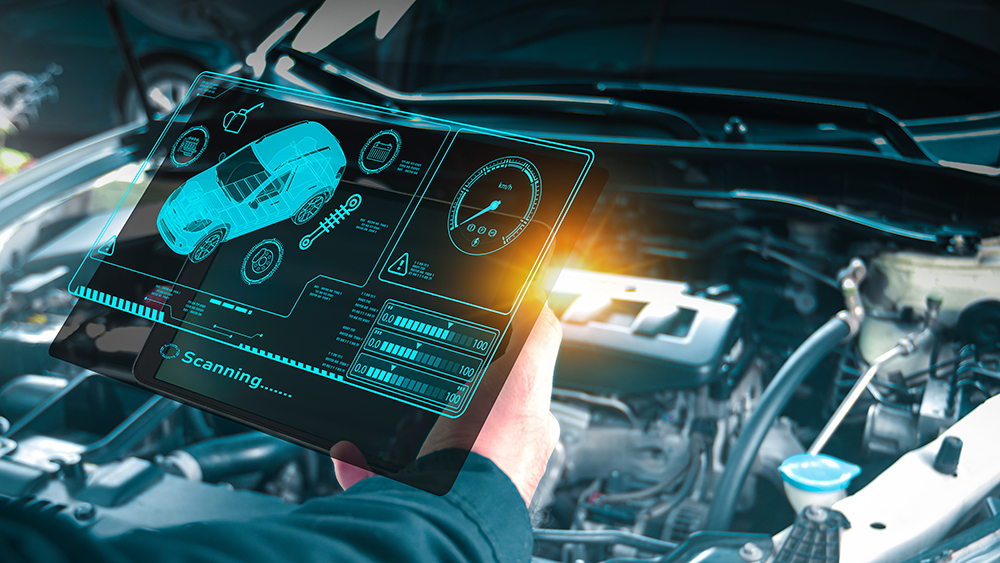 Auto mechanic checking engine system with OBD2 wireless scanning tool