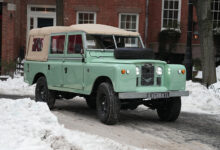 Everrati’s electric Land Rover Series IIA parked in snowy street