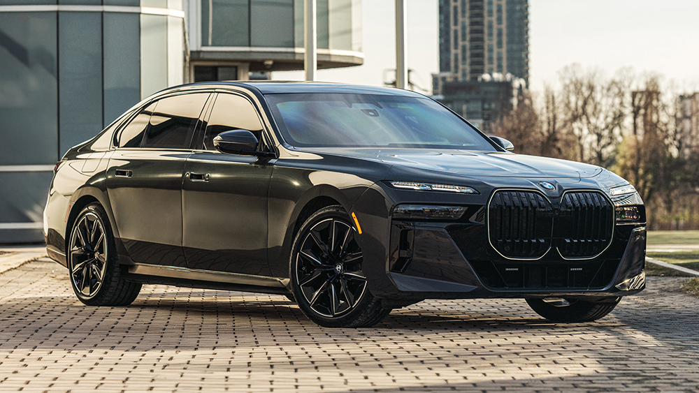Black INKAS Armored BMW 7 Series in front of building