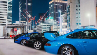Porsches parked at street at dusk at Luft Tokyo