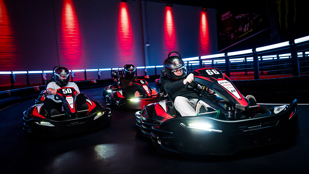 Karts racing on track at RPM Raceway