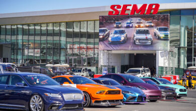 Row of Cars in front of Las Vegas Convention Center and SEMA sign