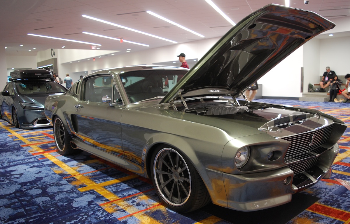 street suspension gray-green mustang restomod in hallway at sema show 2026