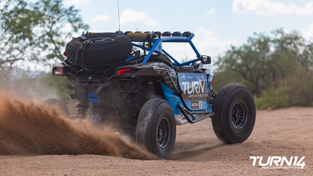 T14 x Bilstein Can-Am Maverick X3 kicking up sand