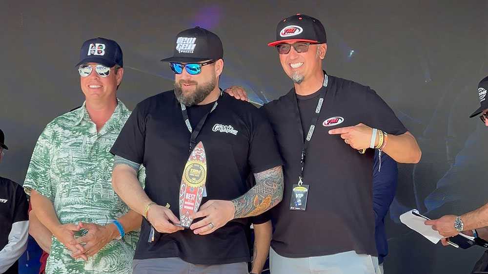Shannon Gaither accepting the trophy for the 2026 TMI TRIM Road Tour victory.