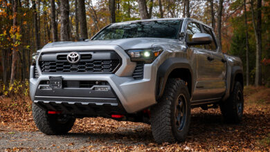 Silver Toyota Tacoma parked in forest