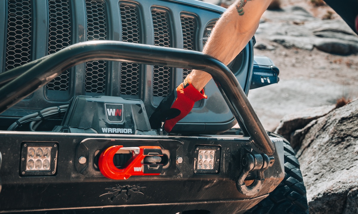 winches warrior winch jeep bumper mount with gloved hand