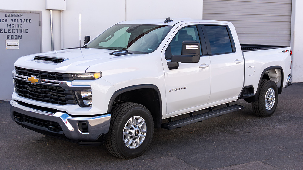 The Raptor Series HD WorkStep mounted on a white Chevrolet truck