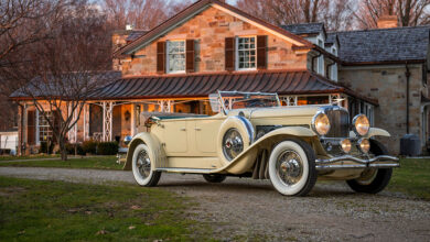 1931 Duesenberg Model J Tourster by Derham in front of house