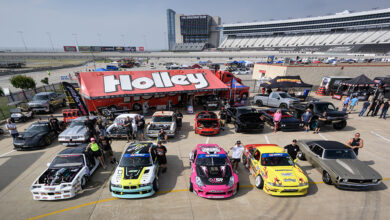 Holley tent with performance cars at race track