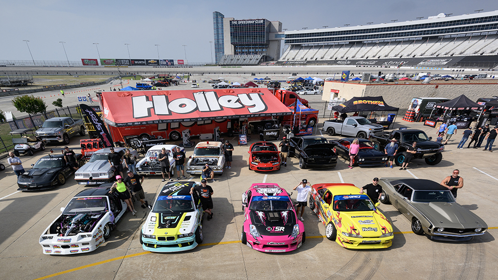 Holley tent with performance cars at race track