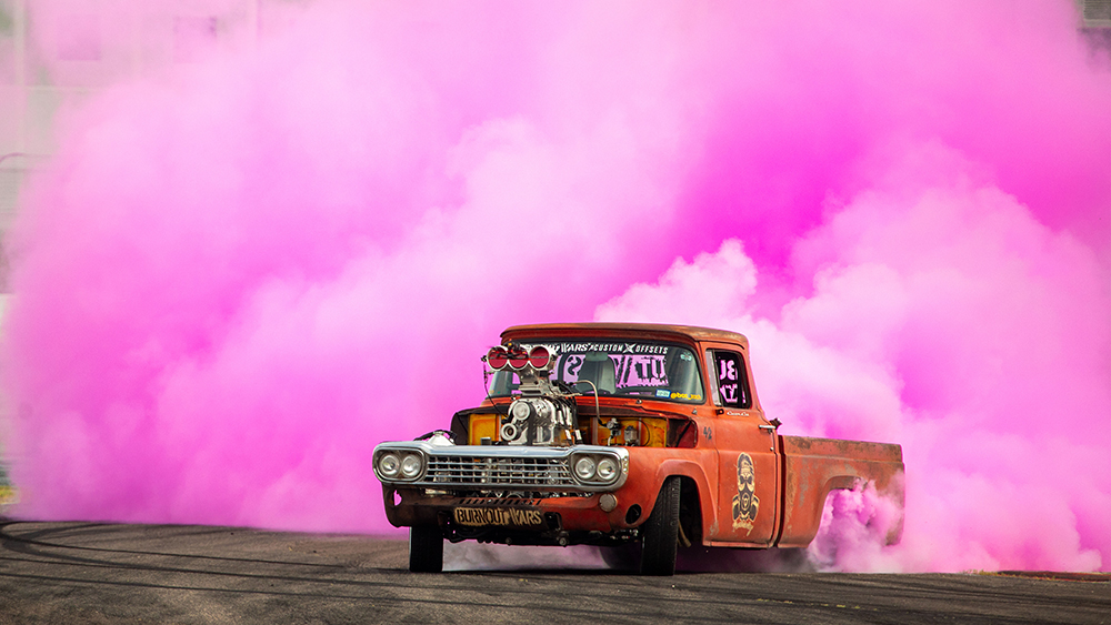 Classic truck drifting with lots of pink smoke