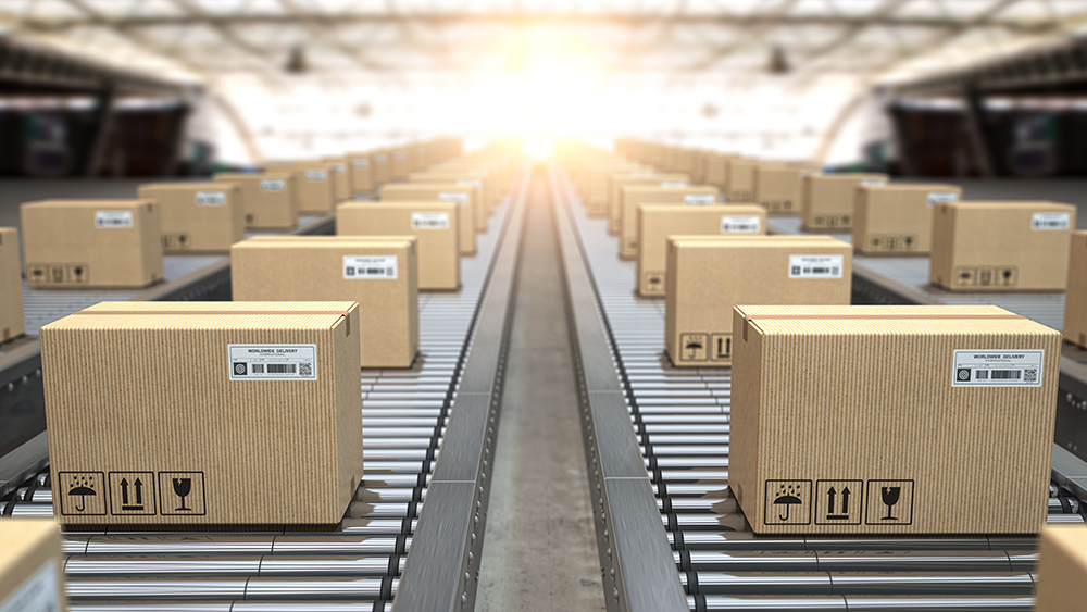 Boxes on conveyor rollers in warehous