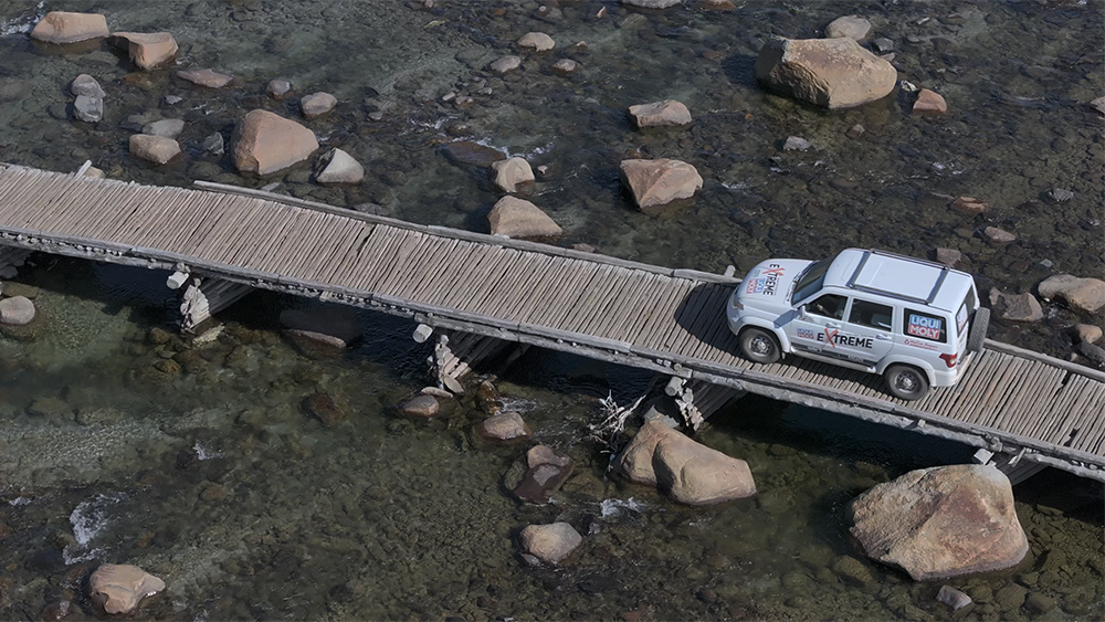 LIQUI MOLY Extreme vehicle driving over wooden bridge