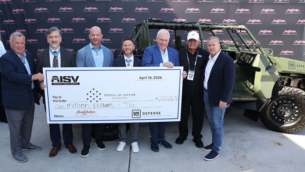 Men holding $1M check for Medal of Honor Foundation