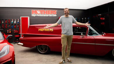 Mothers indoor display with man holding arms wide
