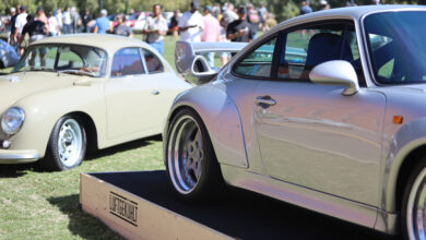 Porsche cars on display at Luft 11 with crowd in background