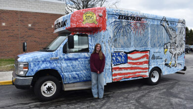 Riverside Sophomore Ava Passalacqua with 2026 winnng Art Bus Design