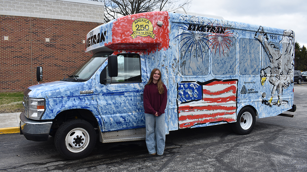 Riverside Sophomore Ava Passalacqua with 2026 winnng Art Bus Design