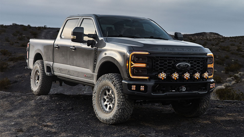 Ford truck with row of Baja Designs Squadron 2.0 LED lights attached to grille