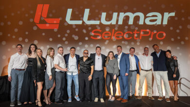 Tinterz accepts LLumar SelectPro 2025 National Dealer of the Year award on stage