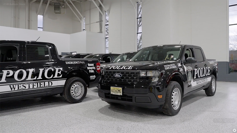 Westfield Police trucks parked inside building