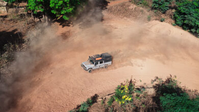 Day 13 - Aerial shot of the Ineos Grenadier on dirt road Guinea