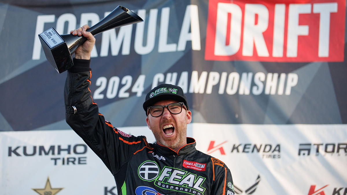 Formula Drift icon Odi Bakchis holding trophy