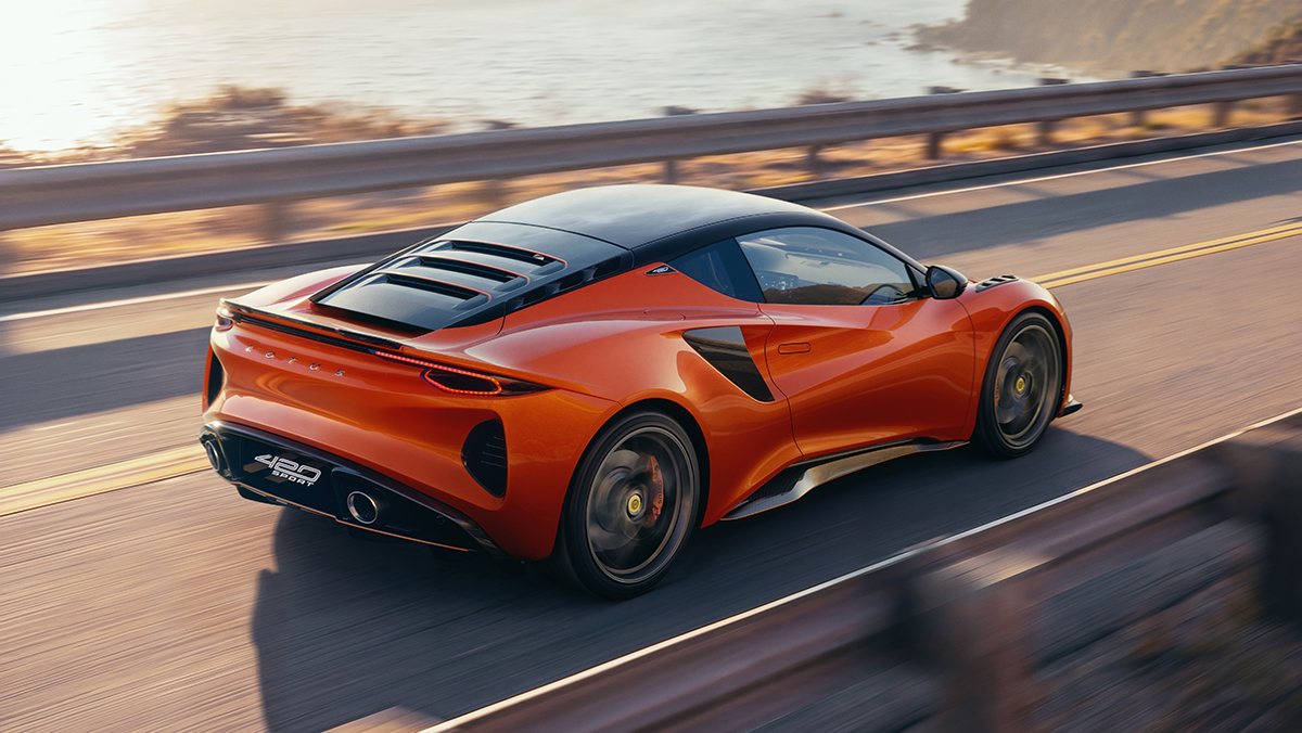 Lotus Emira 420 Sport Rear Three Quarter View Driving on Road