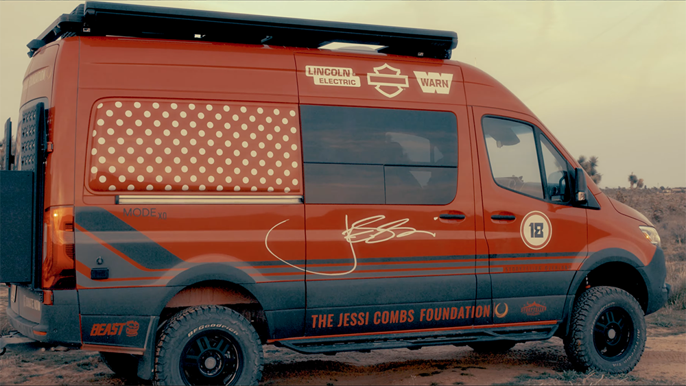 Trailblazer Tour Van, a fiery red Storyteller BEAST MODE