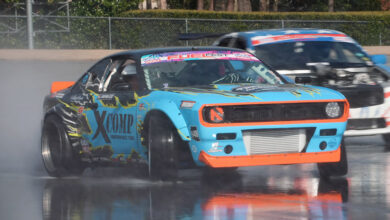 Two cars drifting in water at XCOMP Ride & Drive event