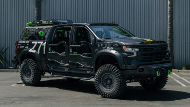 A custom military utilitarian Chevy 1500 Silverado build front three-quarter view