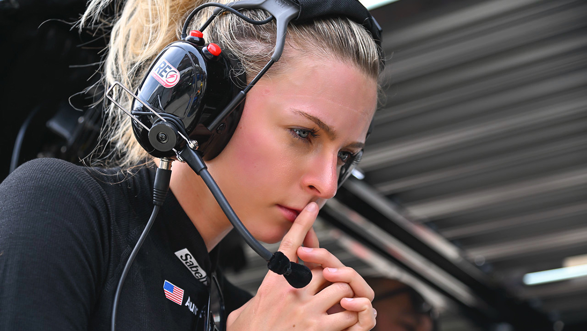 Aurora Straus trackside with racing headset