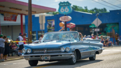 Car leaving Expo Square to start Tulsa's Route 66 Capital Cruise