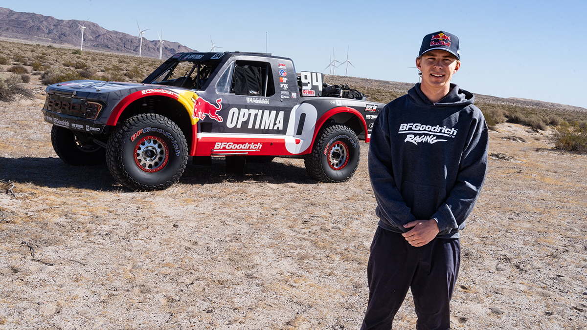 Christopher Polvoorde standing in front of BFGoodrich Baja 500 truck in desert