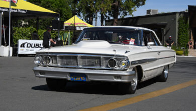 Classic car driving on road