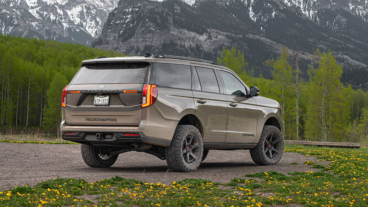 Hennessey Ford Expedition Tremor VelociRaptor SUV back three-quarter view with mountains in background