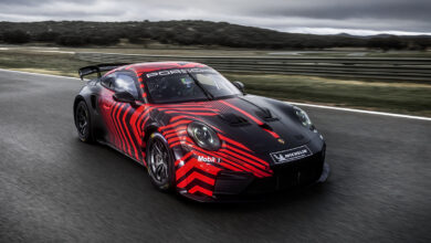 Porsche 911 GT4 R parked on racetrack