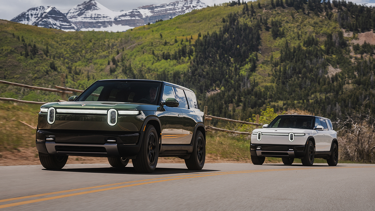 Two Rivian R2s on road