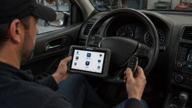 Technician using Topdon device in driver's seat