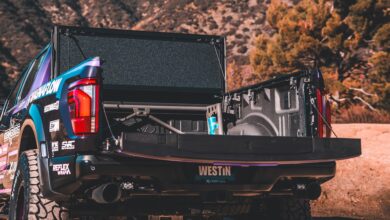 tonneau cover westin open on black truck in desert