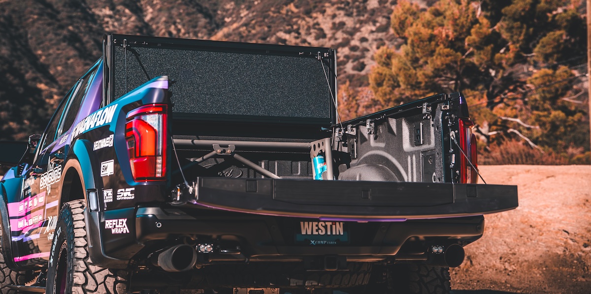tonneau cover westin open on black truck in desert