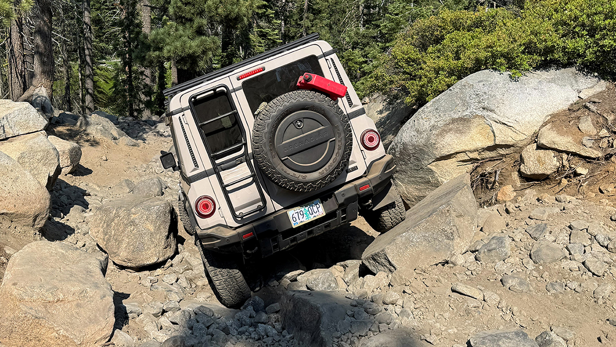 INEOS Grenadier driving over large rocks on Rubican Trail