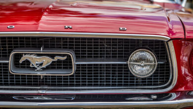 Close up detail view of a 1965 Ford Mustang GT Coupe headlight and grille
