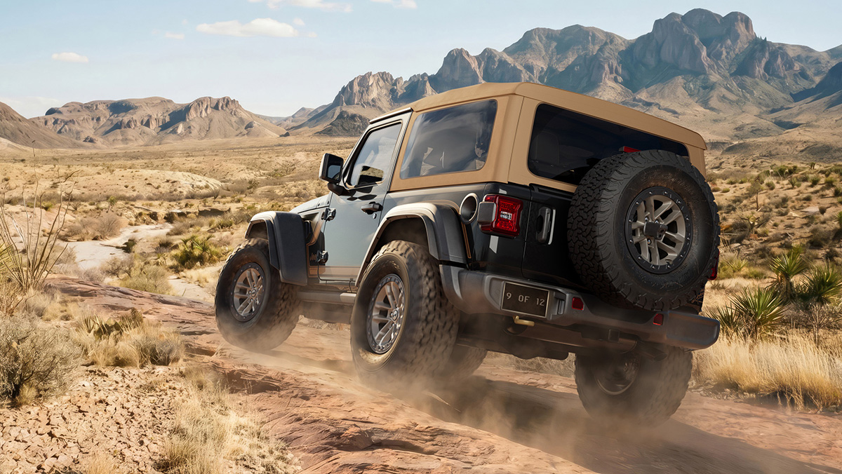 The 2027 Jeep Wrangler Laredo two-door kicking up dust down the trail.