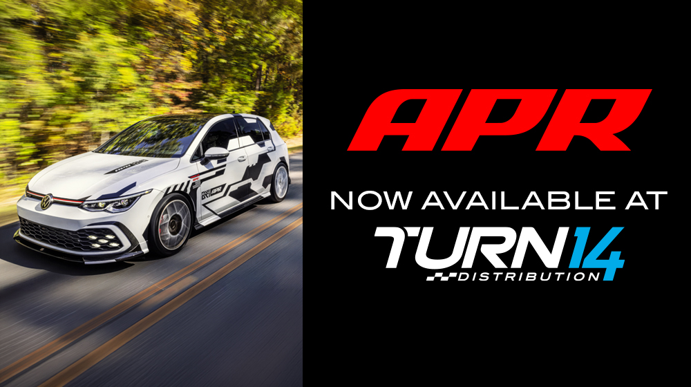 APR and Turn 14 Distribution Logos with Volkswagen vehicle on road